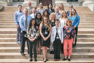 Group of pathologists standing in front of Harvard Medical School stairs
