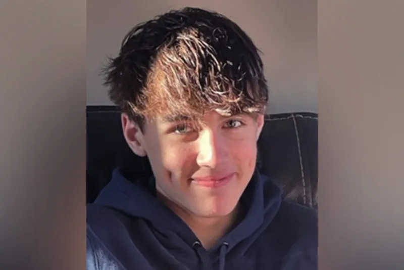 Teen boy poses for camera