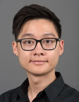 Headshot of Chet Mun, a man with glasses and dark hair has a closed lipped smile for the camera.