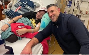 Mike Vrabel sitting next to bed of Boston Children's Hospital patient